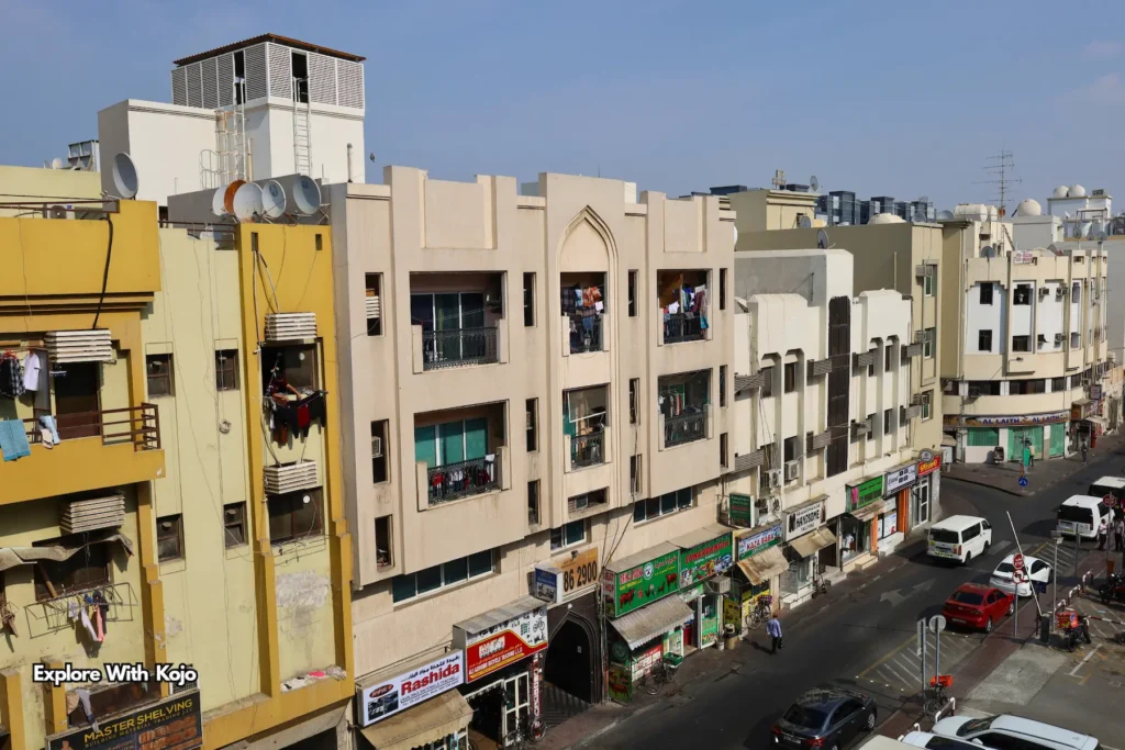 Old residential apartment blocks in Deira with air conditioners and hanging clothes