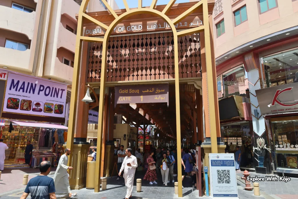 Dubai Gold Souk Gate 1 entrance surrounded by shops and visitors