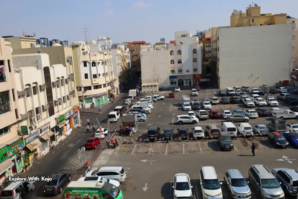 Deira parking area surrounded by old buildings