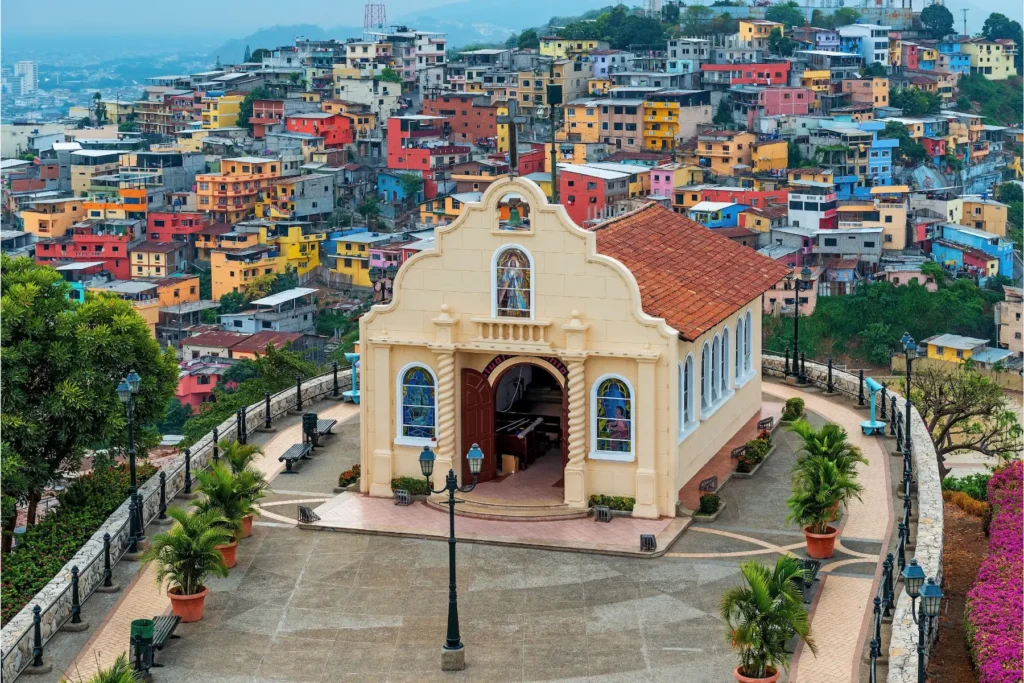 View of colorful houses and church in Guayaquil, Ecuador.