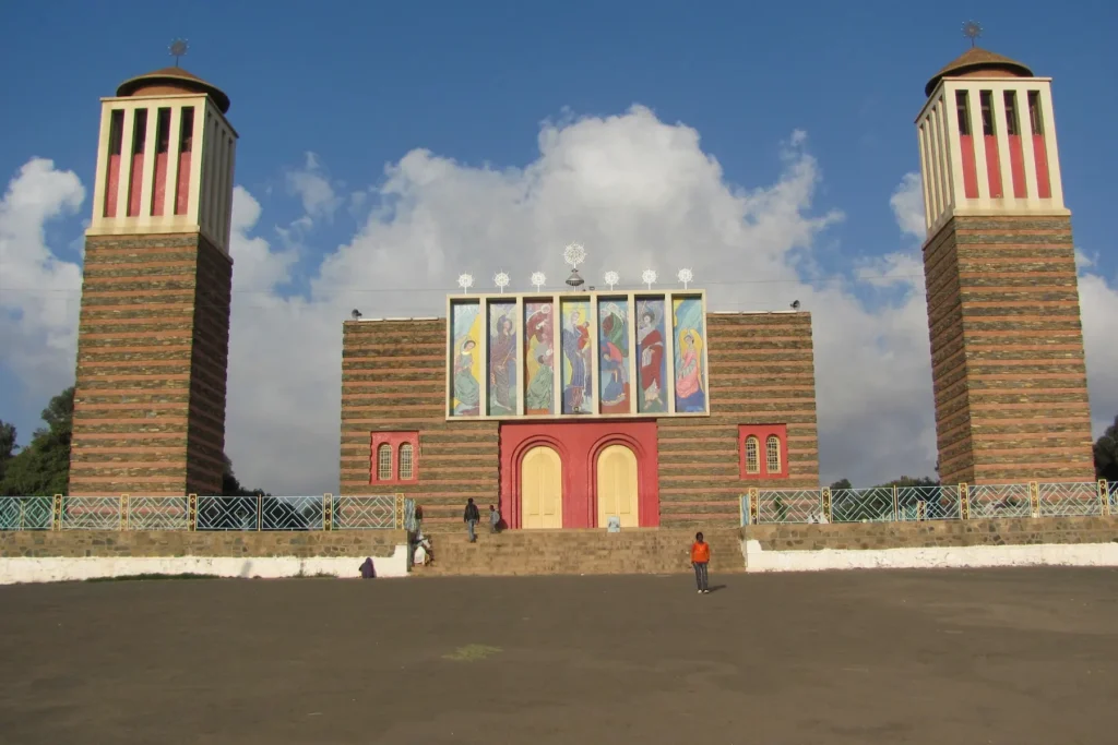 Historic church in Asmara, Eritrea against a bright blue sky.