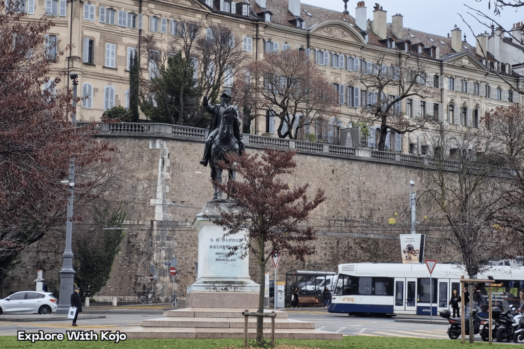 A street scene in Geneva, Switzerland, showing clean streets, public transport, and historical architecture captured by Explore With Kojo