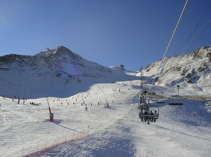Snow-covered slopes and ski lifts at Grandvalira Ski Resort in Andorra.