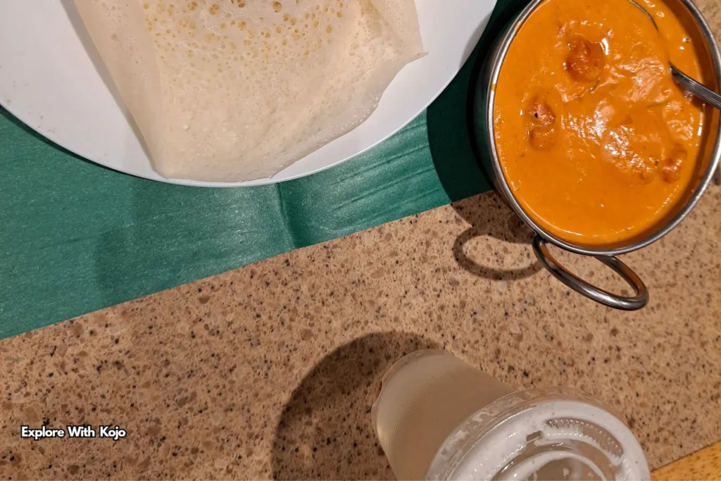 Plate of dosa with curry and lassi drink in Singapore’s Little India
