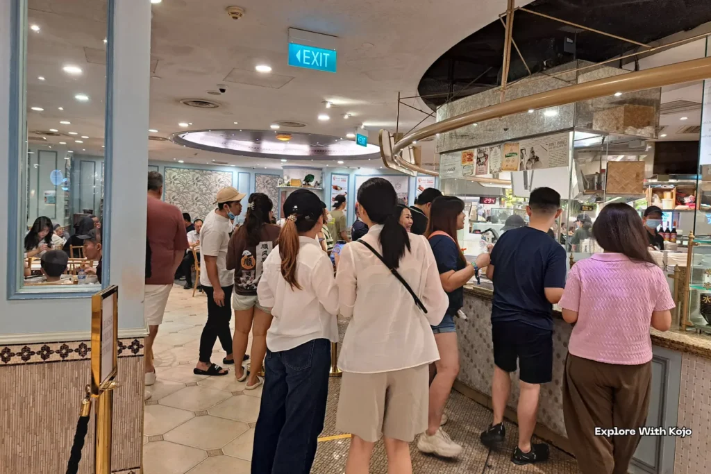 Shoppers queuing at Food Opera stall in ION Orchard Singapore