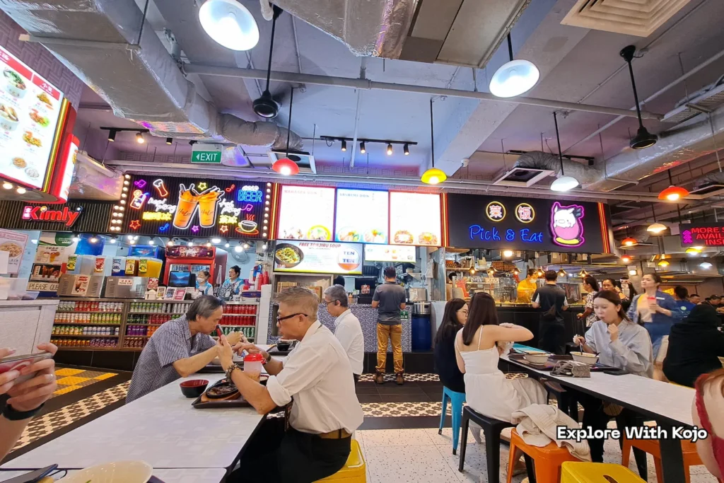 Diners enjoying affordable meals at Lucky Plaza food court