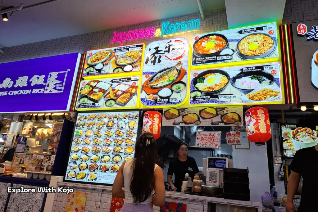 Food stall menus on display at Lucky Plaza food court