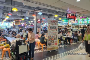 Rows of hawker stalls inside Lucky Plaza food court