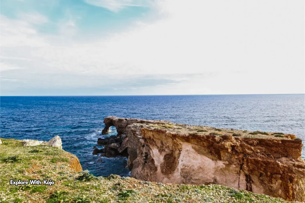 Dramatic coastal rock formation along Malta’s rugged shoreline overlooking the Mediterranean Sea