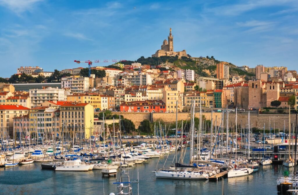 Boats at the Old Port of Marseille with Notre-Dame de la Garde in the distance