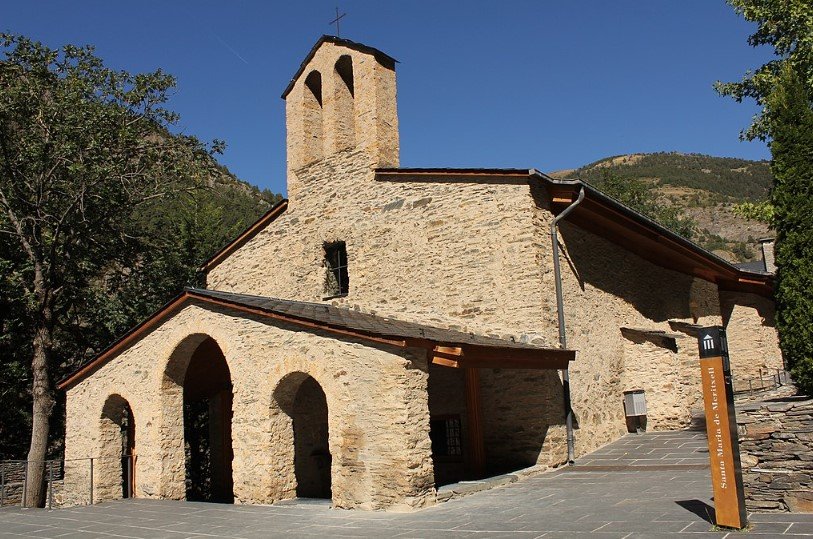 Meritxell Sanctuary church in Andorra surrounded by mountains.