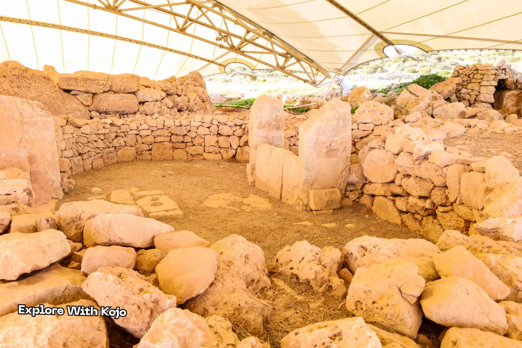 Upper chamber of Mnajdra Temple in Malta under a protective canopy.
