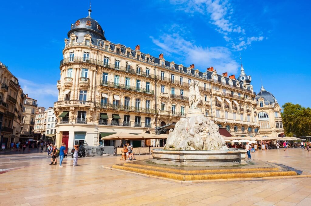 View of Place de la Comédie square in Montpellier with historic buildings
