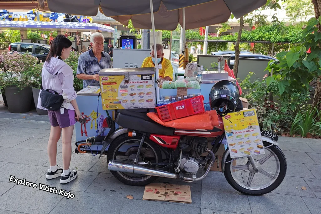 Street vendor selling traditional ice cream sandwiches along Orchard Road Singapore