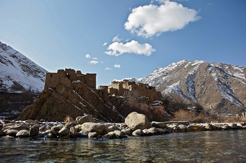 Panjshir Valley in Afghanistan with lush greenery and mountain views.