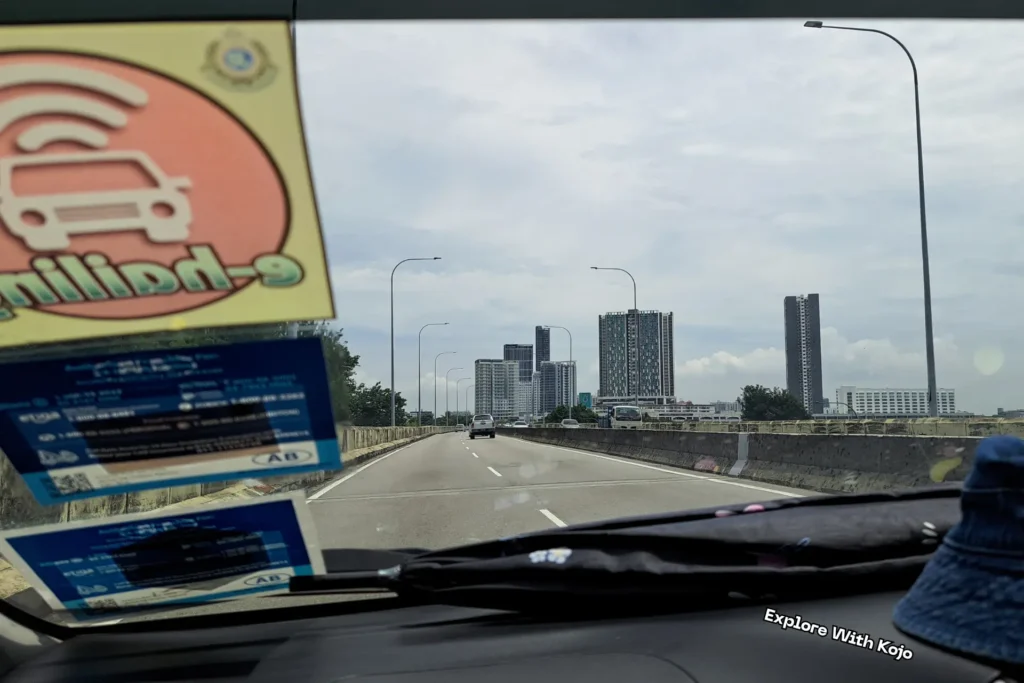 View from inside a car driving from Penang International Airport towards George Town’s skyline