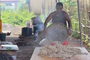 African black soap mixture being poured from pot to dry in Ghana