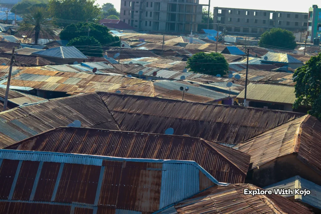 Overhead shot of multiple rusty rooftops in Tamale Ghana