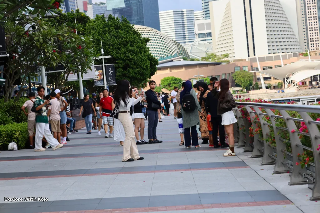 Locals and tourists gathered at the Singapore waterfront near the Esplanade