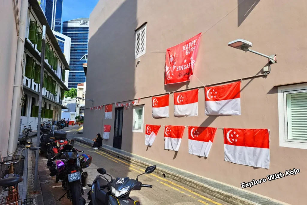 Singapore flags displayed on a building wall during National Day celebrations in Singapore.