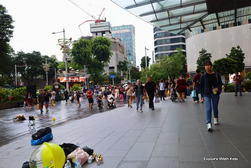 Busy crowd walking along Orchard Road in Singapore