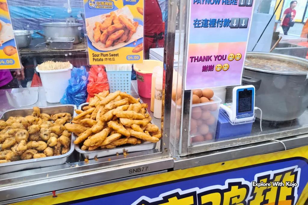 Tray of freshly fried snacks at a Pasar Malam stall in Singapore.