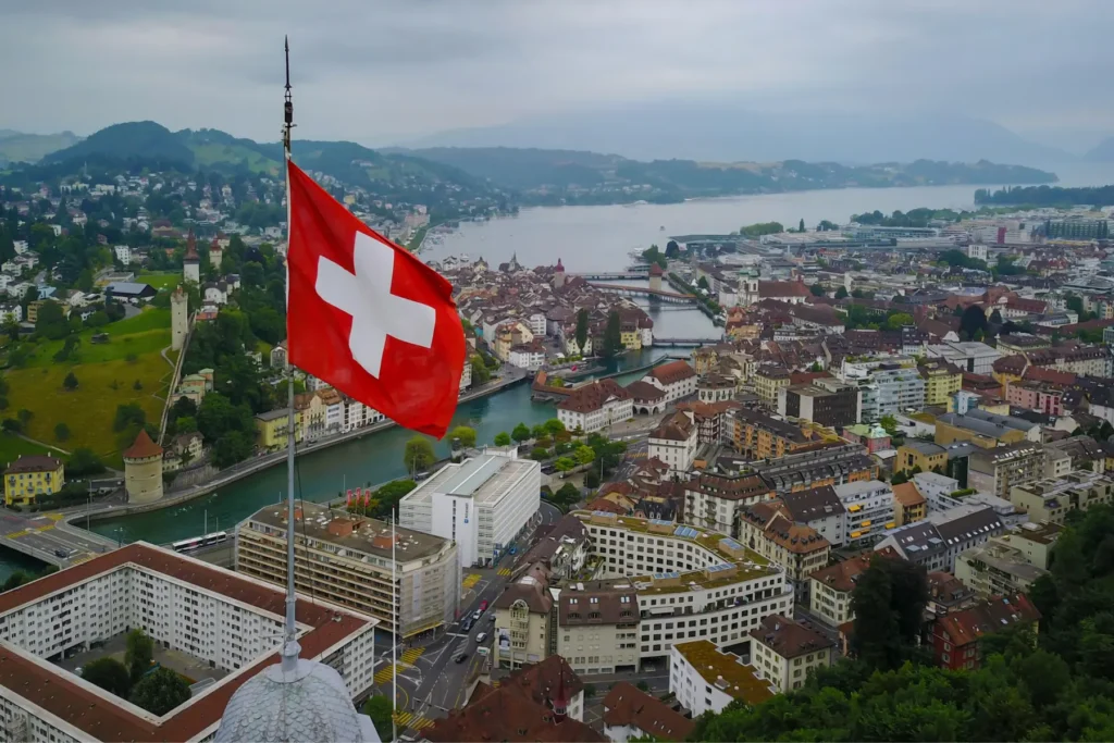 Overhead view of Lucerne, Switzerland with the Swiss flag flying above the city