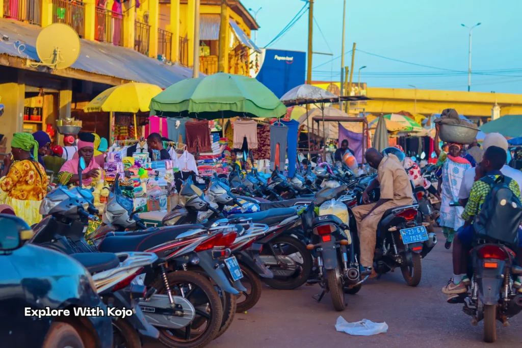 View of Tamale Central Market with vendors and motorbikes