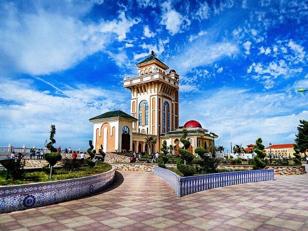 Tlemcen city in Algeria with Islamic architecture and mountain backdrop. 