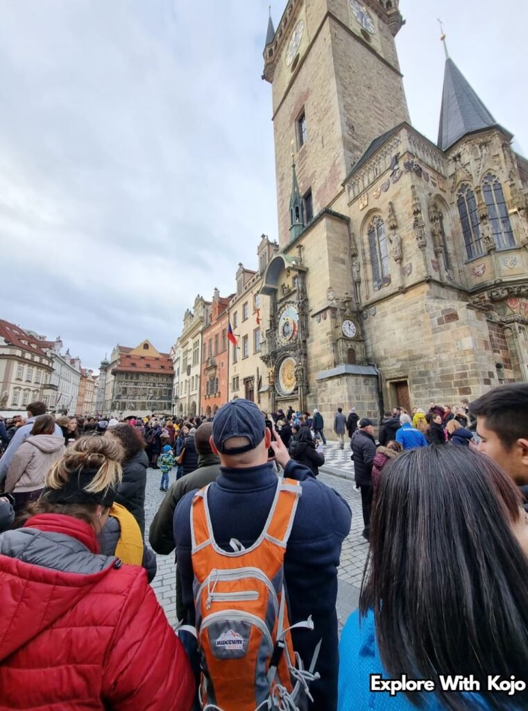 Crowds of tourists gathered in Prague’s Old Town Square near the Astronomical Clock, symbolizing travel experiences in Europe.