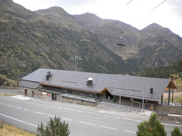 Mountain slopes and cable cars at Vallnord Pal Arinsal ski area in Andorra.