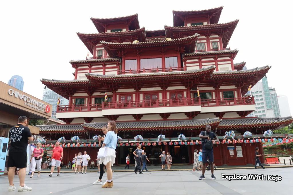Kojo standing in front of the Buddha Tooth Relic Temple in Singapore’s Chinatown.