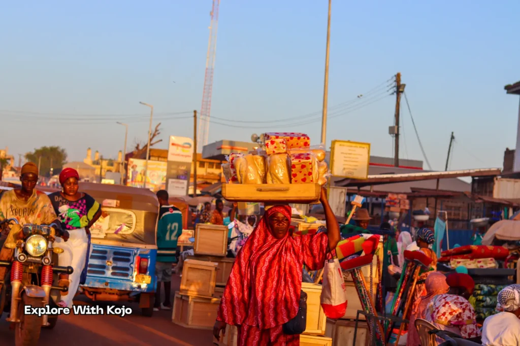 Woman selling loaves of bread at Tamale market