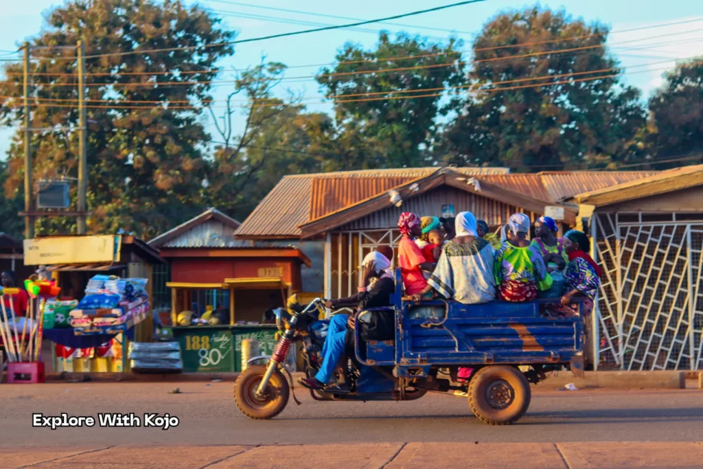 Group of women riding in Motorking tricycle taxi in Tamale Ghana