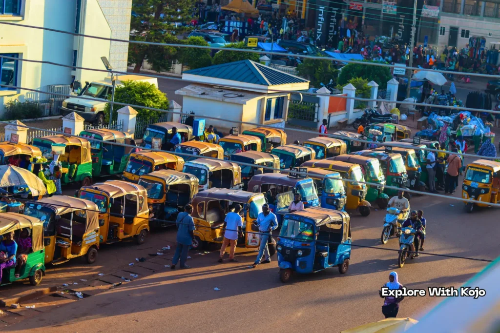 Line of Yellow Yellow tricycles parked at a station in Tamale Ghana