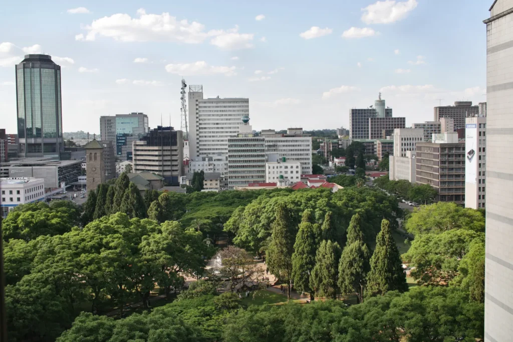 Aerial view of Harare city center with green trees and modern buildings in Zimbabwe.