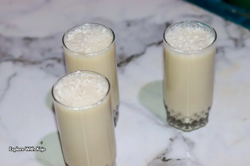 Three glasses of zimkom, a spicy Ghanaian ginger drink