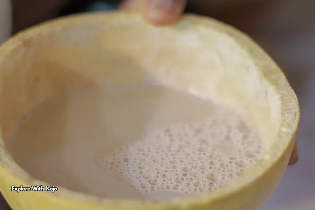Traditional Ghanaian zimkom ginger drink served in a calabash