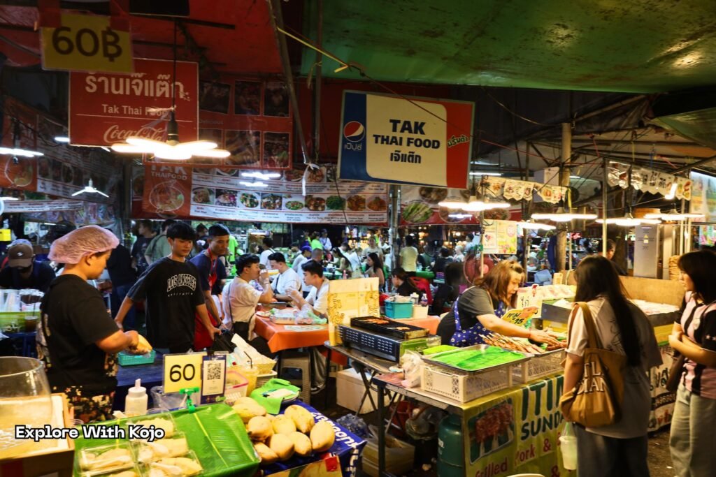 Street food stalls at Chatuchak Weekend Market in Bangkok.
