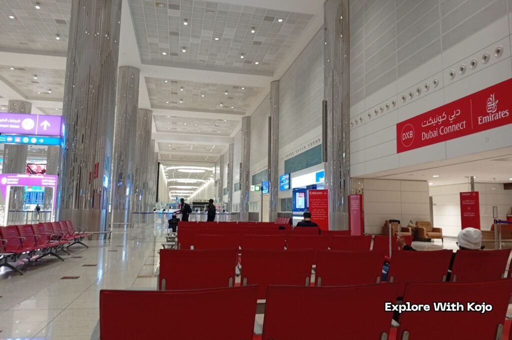 Waiting area at Emirates Dubai Connect in Dubai International Airport for passengers awaiting visa and hotel processing