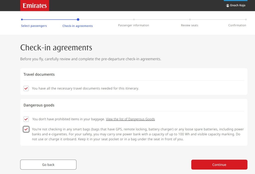 Emirates online check-in screen showing passenger agreement on power bank and smart bag restrictions
