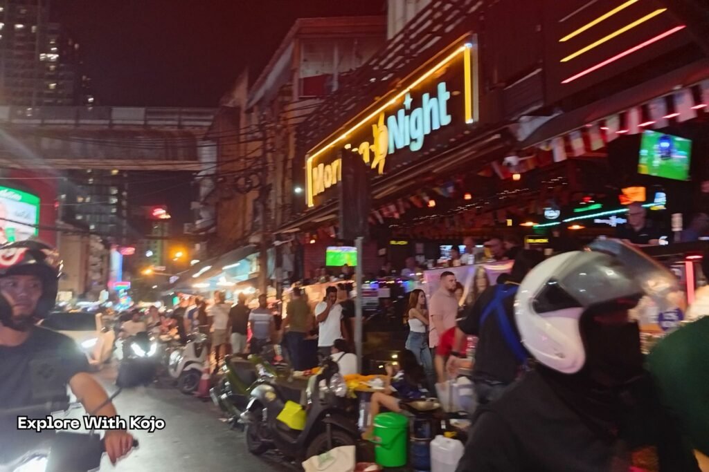 Large crowds and nightlife energy near Nana Plaza in Bangkok.