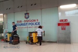 Tourist Police office at a Bangkok airport with travelers walking by