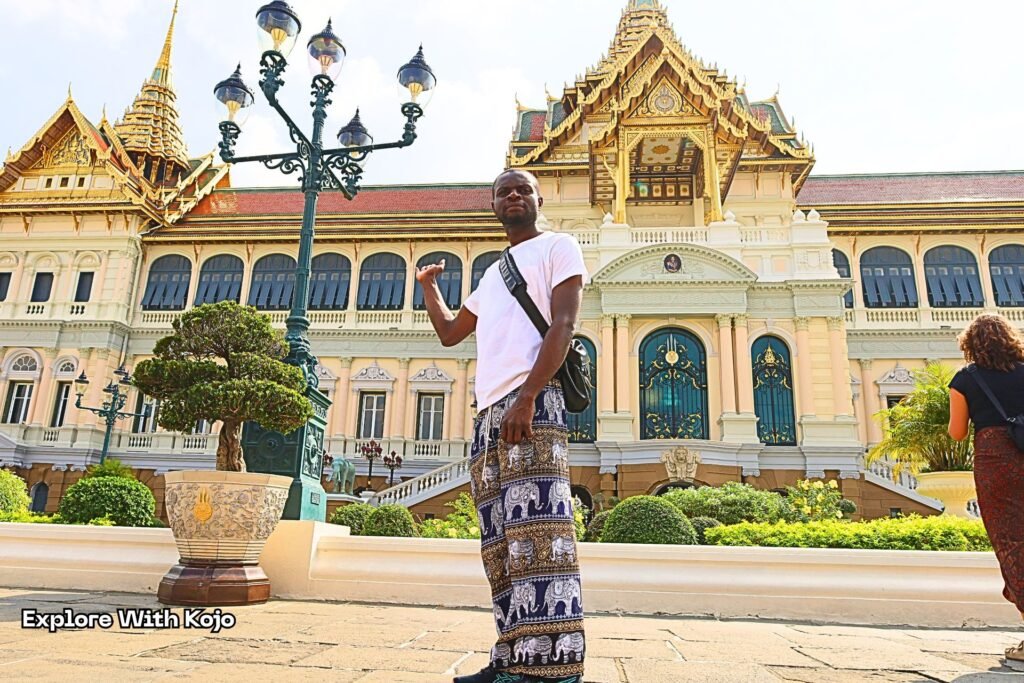 Kojo standing in front of the Grand Palace in Bangkok