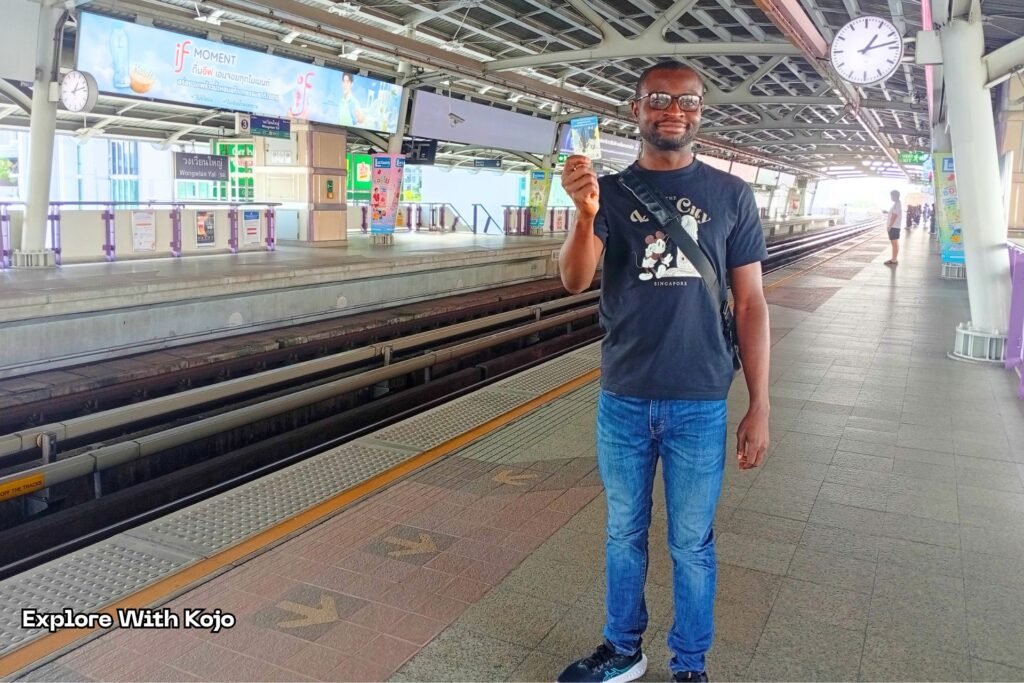 Kojo taking the BTS Skytrain in Bangkok