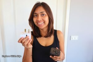 Singaporean traveller Sabrina holding a universal adapter for Thailand power points